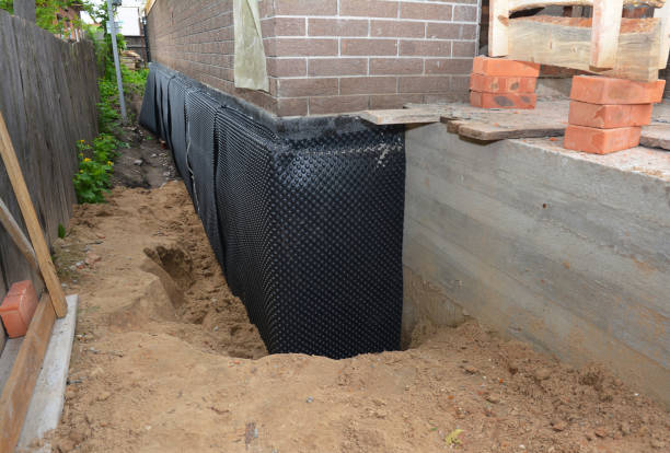 SJ Waterproofing Pros technician performing targeted Waterproofing assessment in Michigan Center, MI